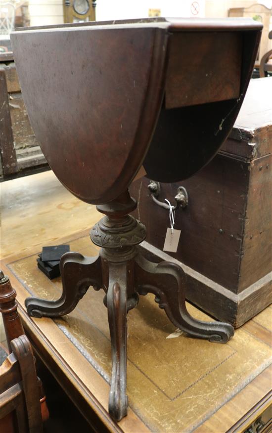 A Victorian walnut oval drop-flap occasional table on pillar and quadripartite base, W.56cm